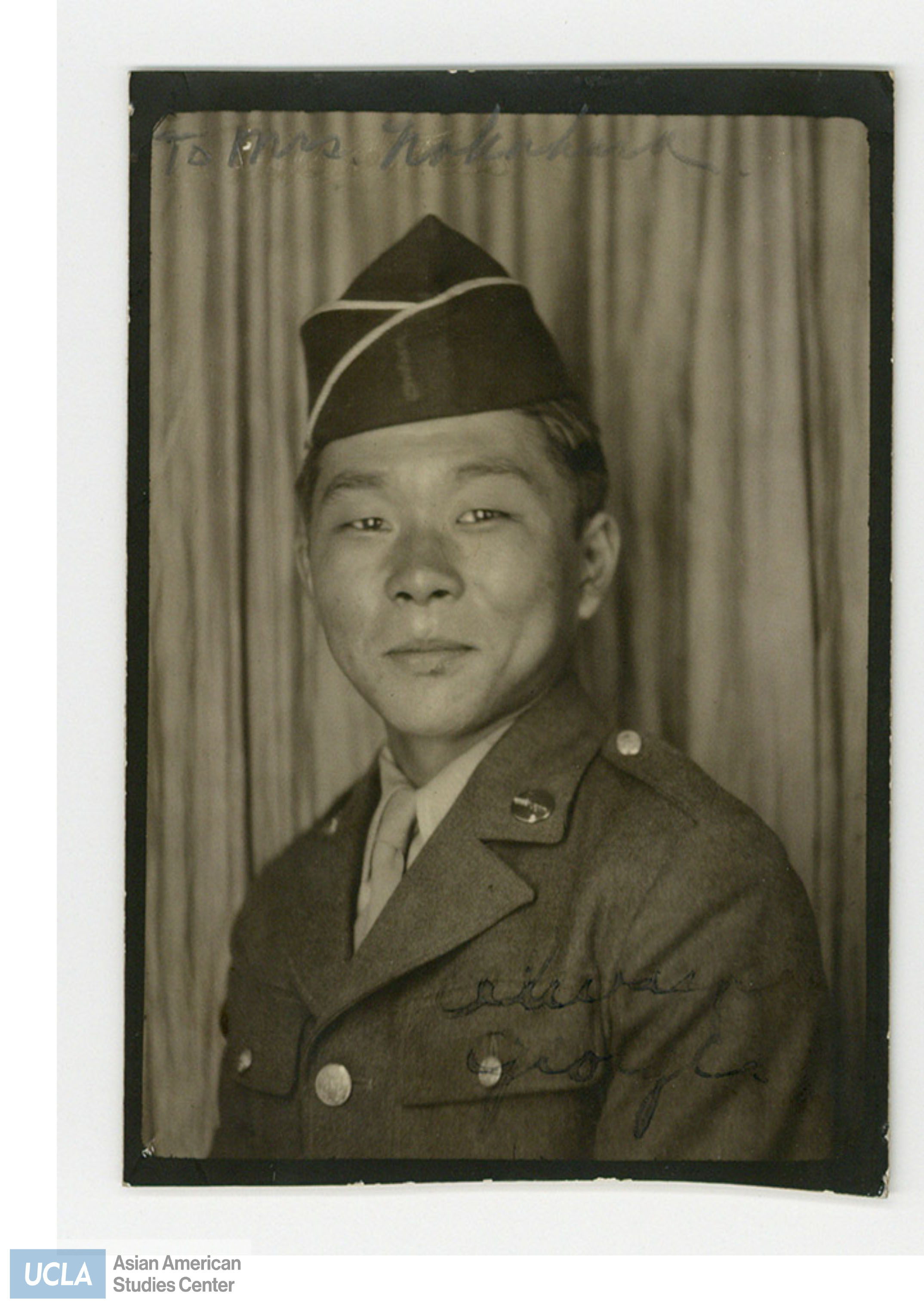 Portrait of George, a Nisei soldier in uniform. The photo is addressed to Mrs. Nakahara. Back of photo includes home address.