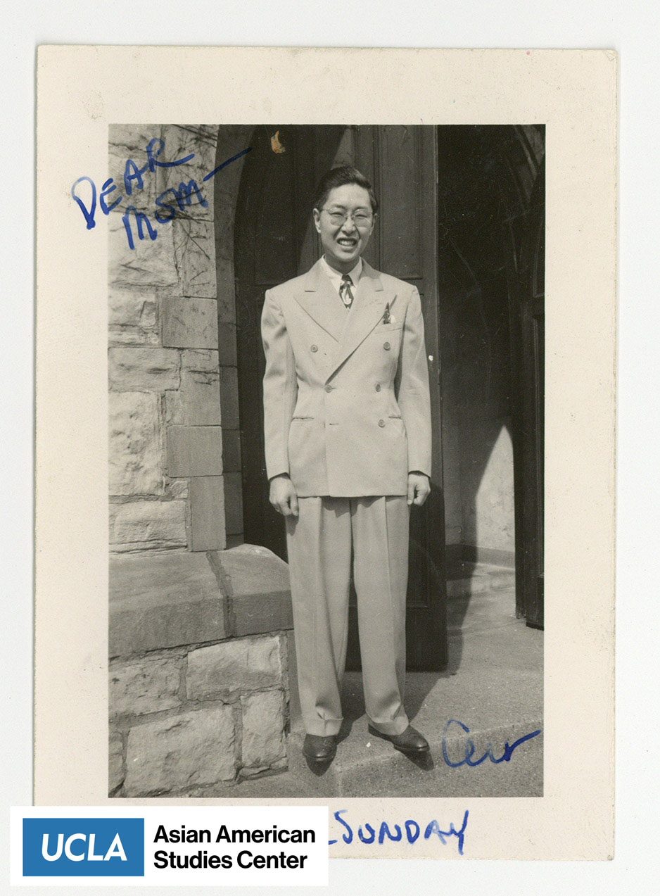 Man in suit stands infront of a church entrance. Text includes: 