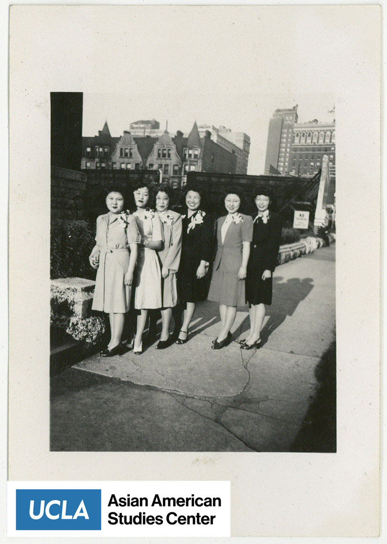 Six Japanese women pose for a photo.