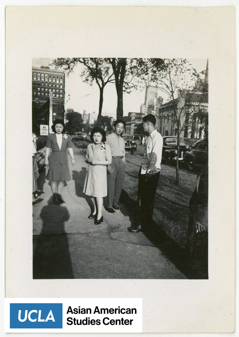 Four young Nisei standing about.