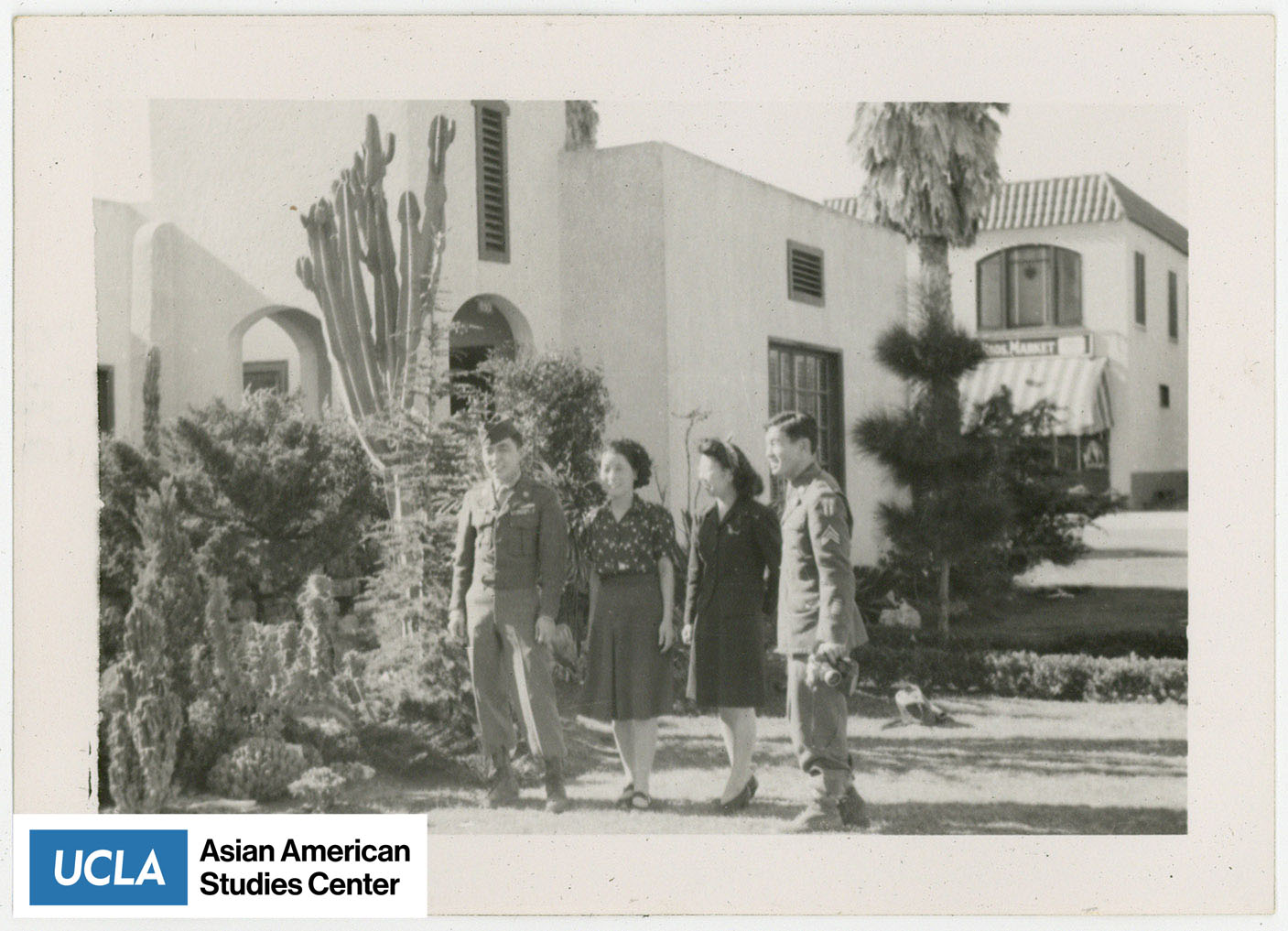 Tsuma and Yuri in center with two Nisei servicemen.