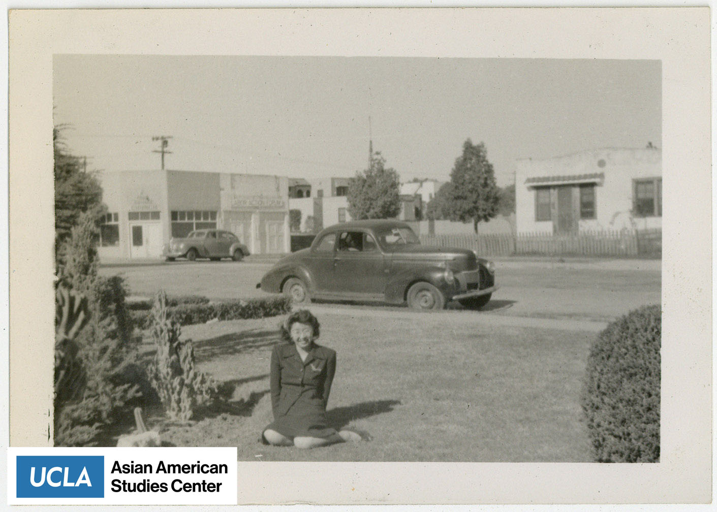 Yuri sits in her front yard of the Nakahara family home.