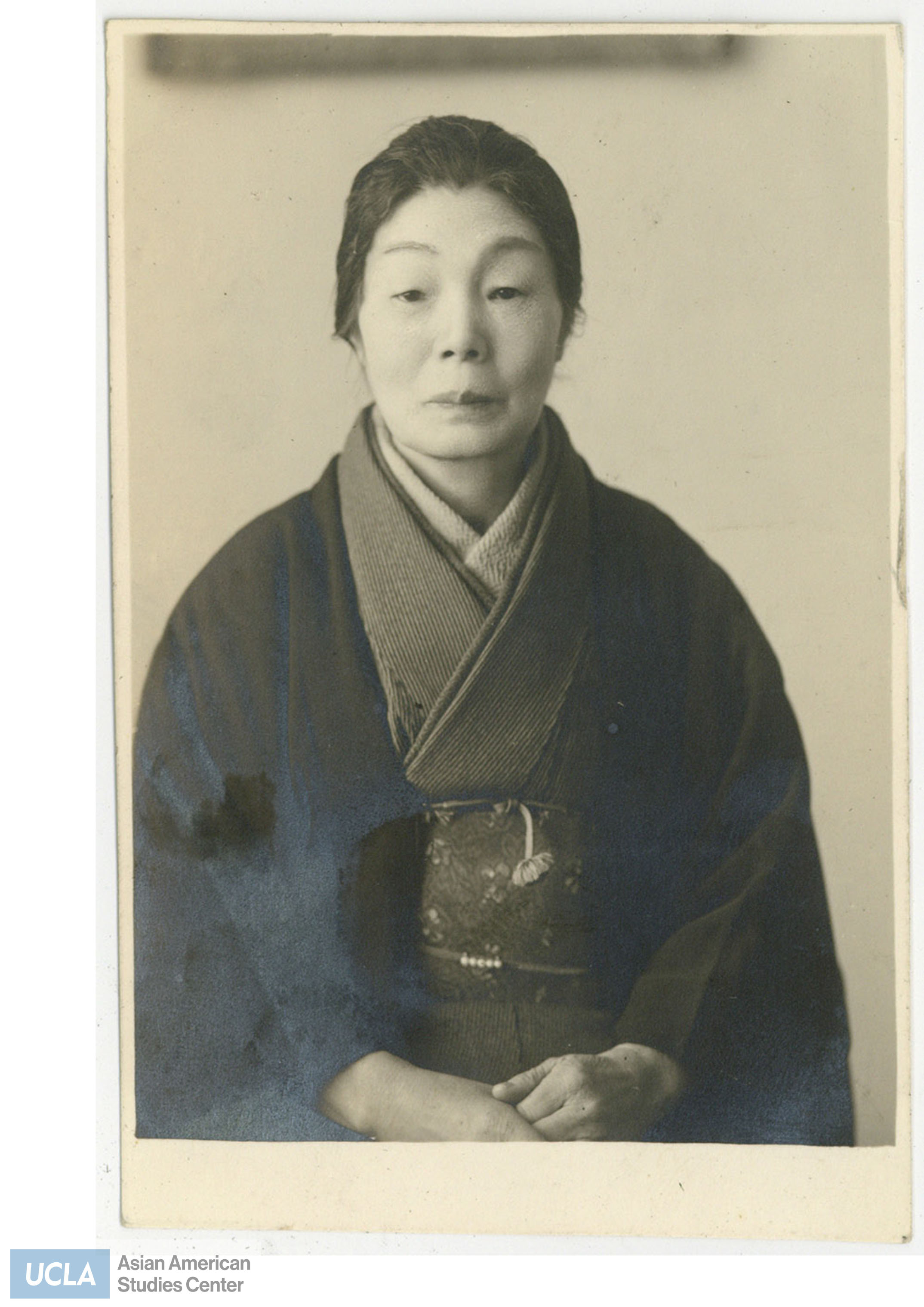Older Japanese woman wearing a kimono.