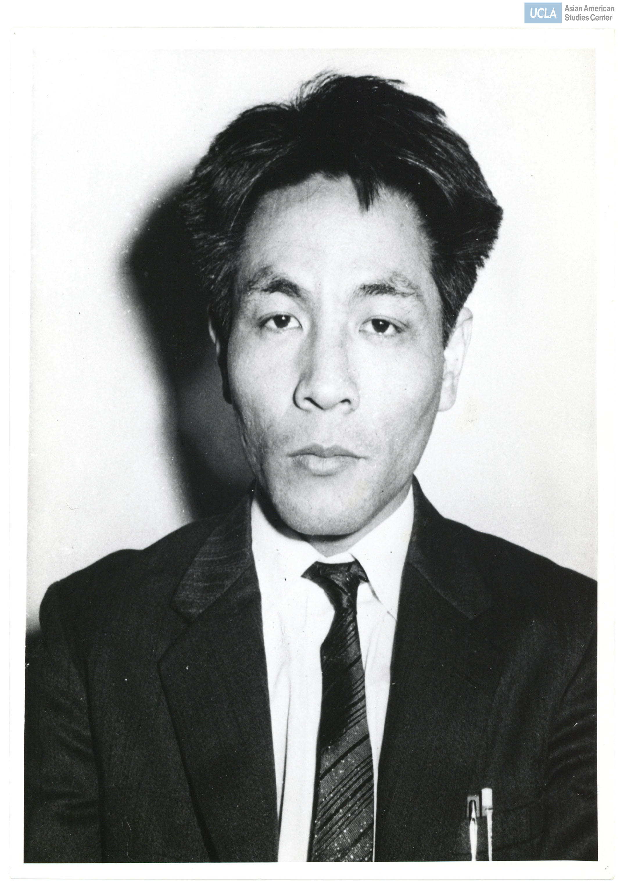 Photograph of Ryuji Hamai in a suit and tie.