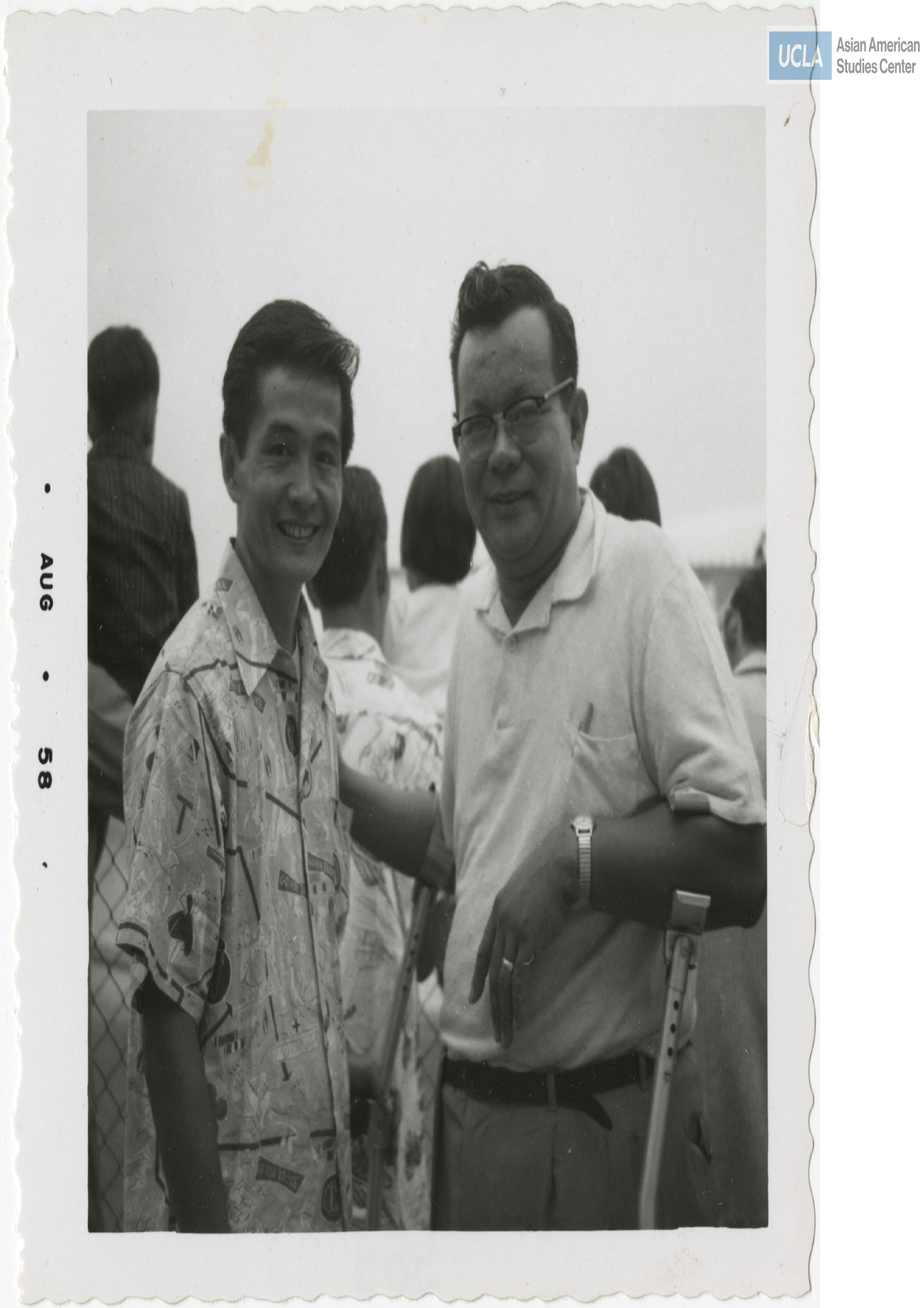 Bill Kochiyama and fellow veteran pose for a photograph during the Nisei Veterans of Foreign Wars reunion.