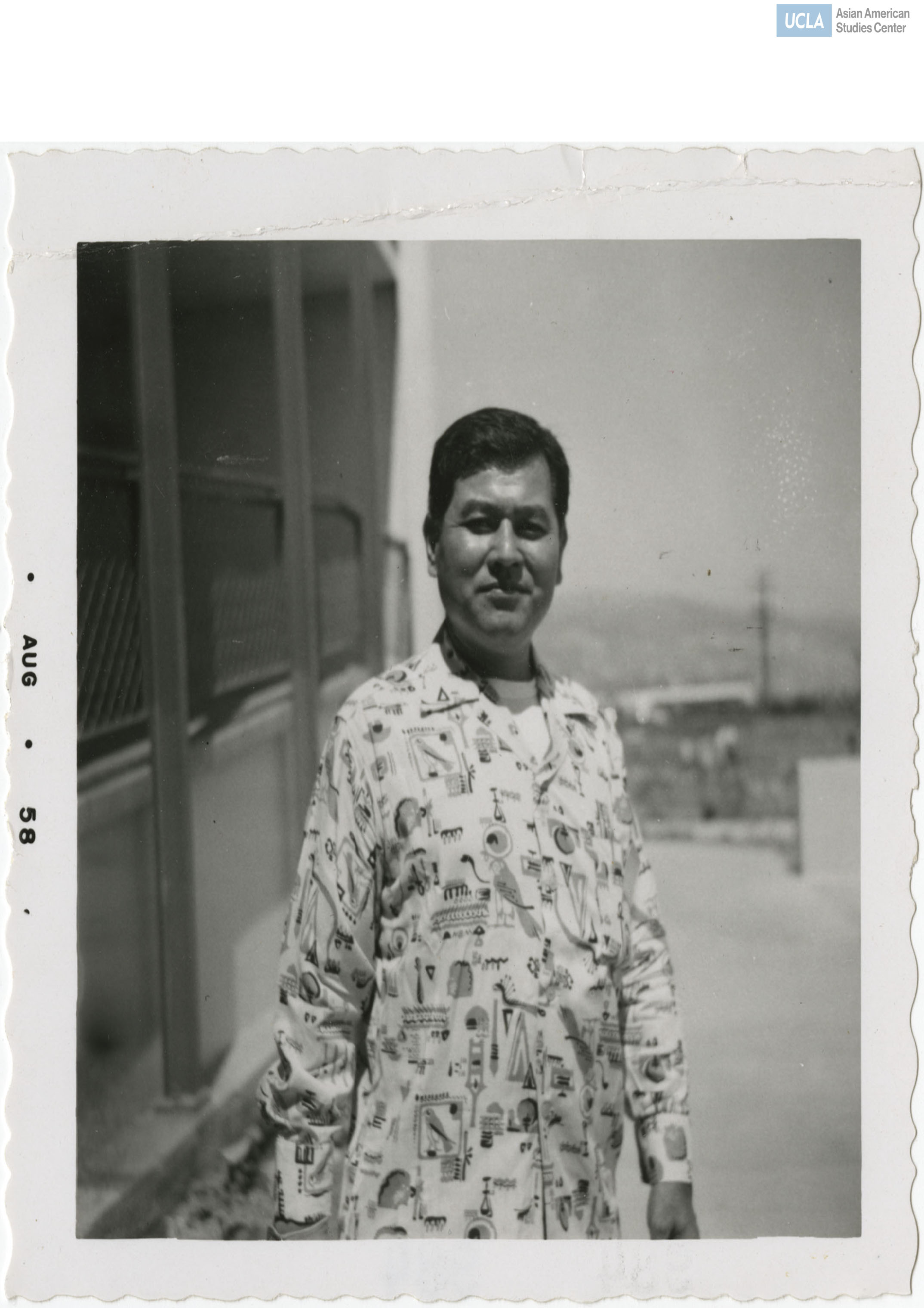 Man wearing a printed Egyptian shirt.