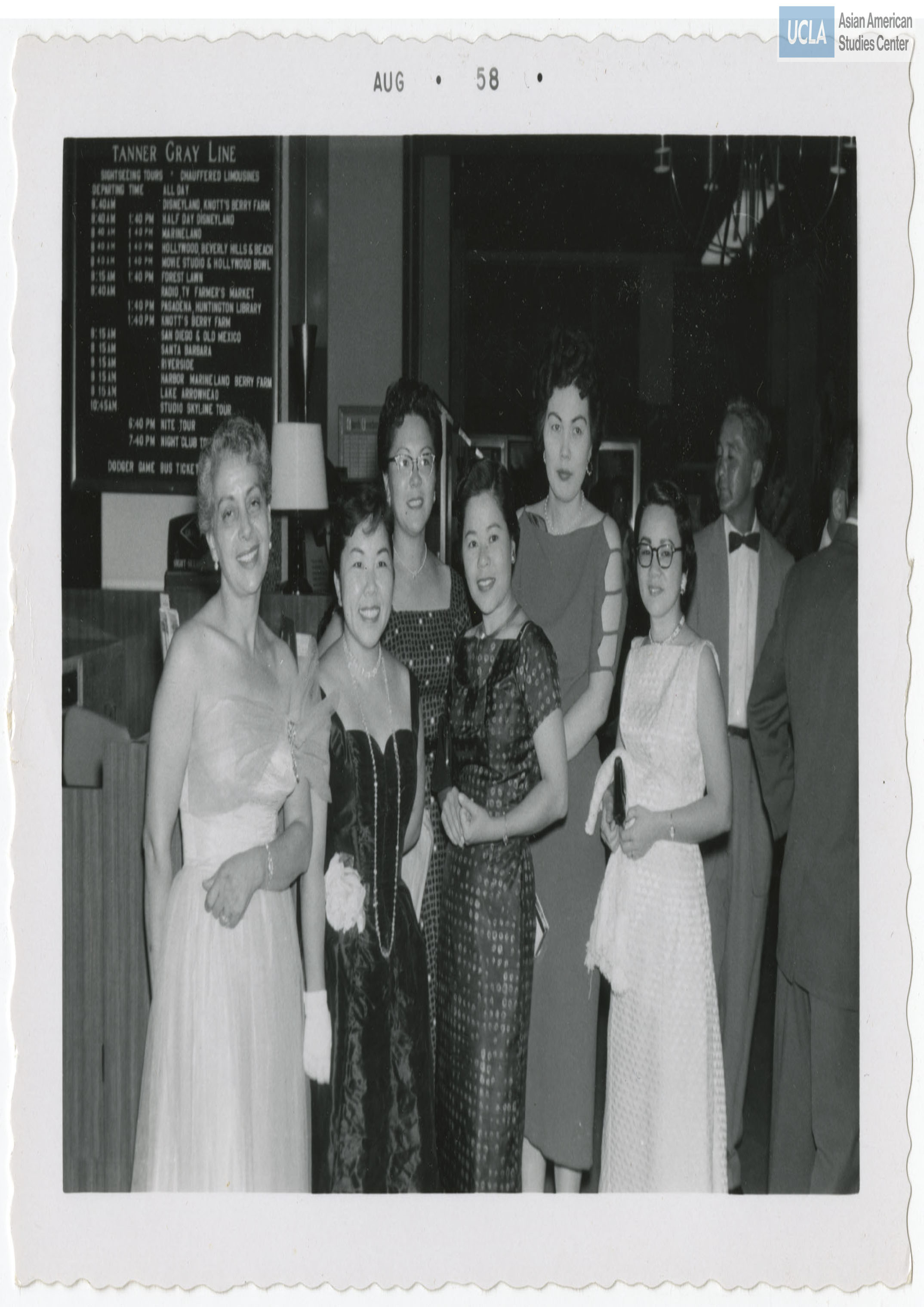 Women in ball gowns pose for a photograph during the Nisei Veterans of Foreign Wars reunion.