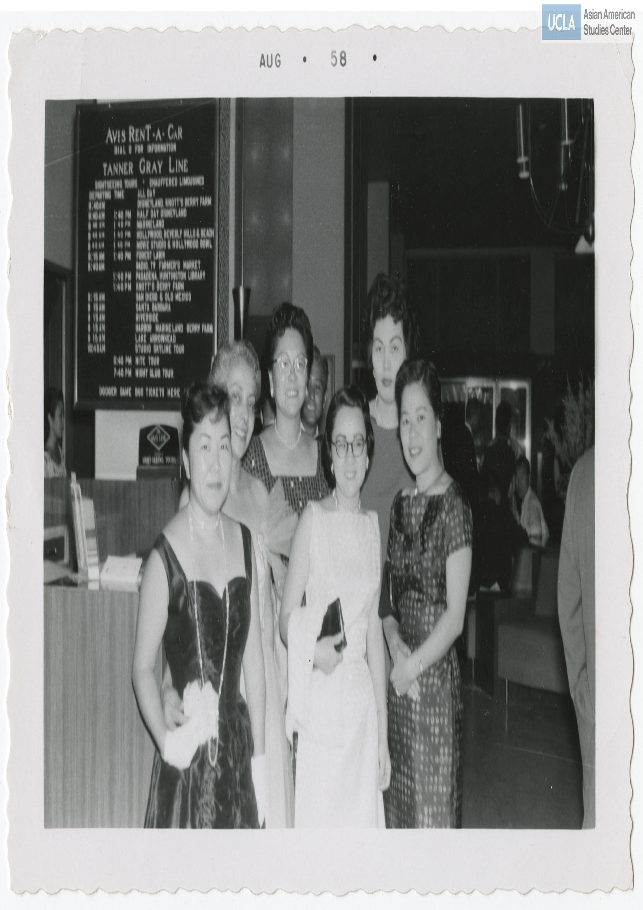 Six women stand and pose for a photograph at the Nisei Veterans of Foreign Wars reunion.